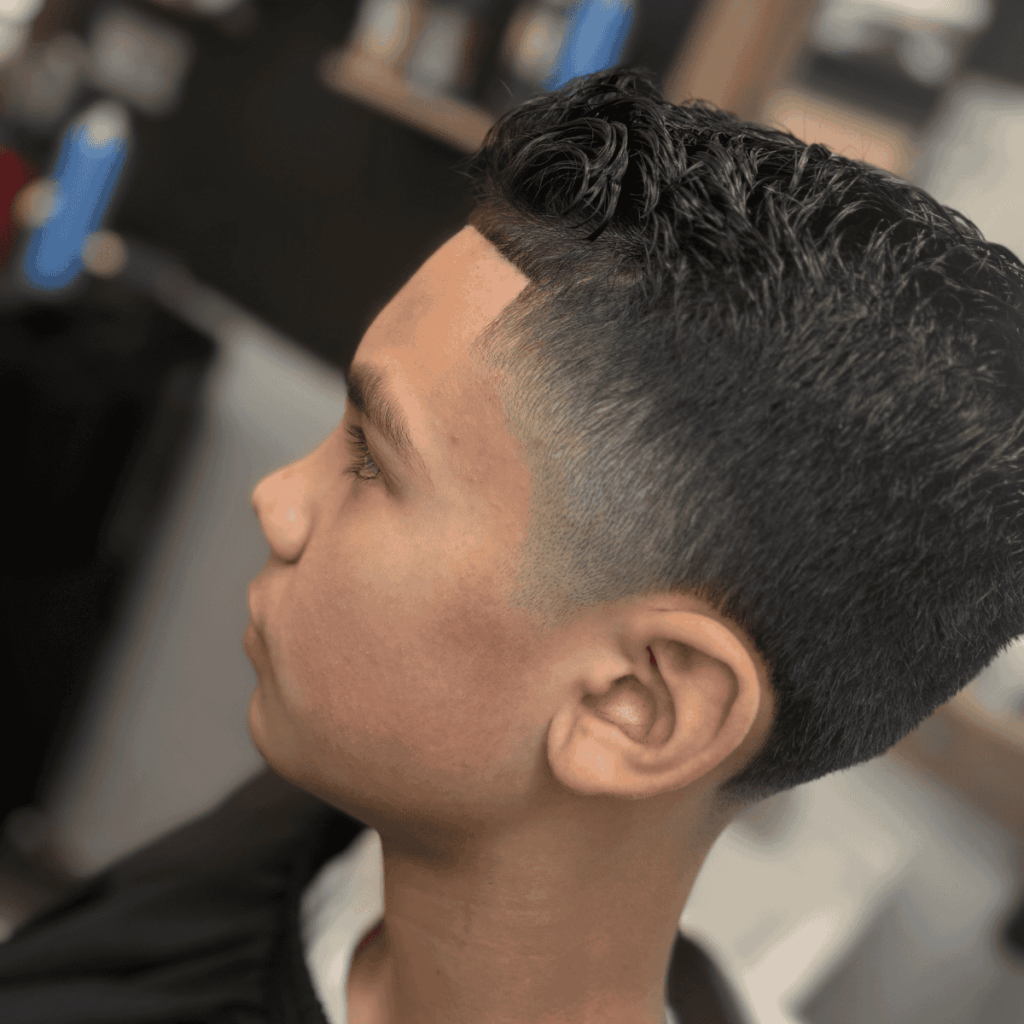 Low skin fade with hard part and lineup at Cutthroat Barbershop Spokane