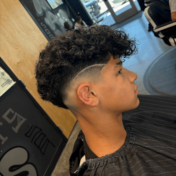 Low skin fade with hard part and lineup at Cutthroat Barbershop Spokane