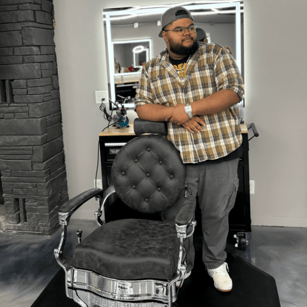 Professional Spokane barber at a modern workstation ready for a haircut appointment