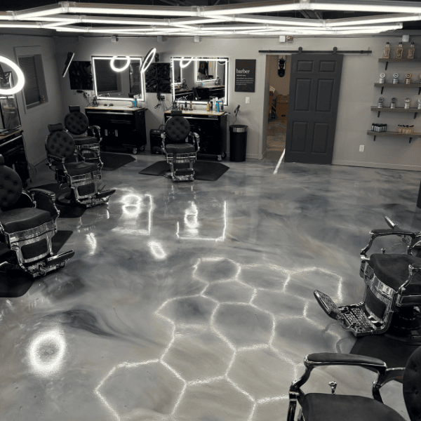 Modern industrial barbershop interior with custom honeycomb lighting in Spokane