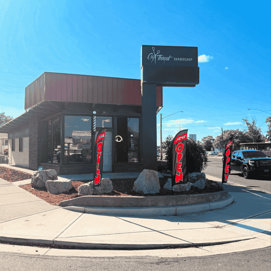 Exterior view of Cut Throat Barbershop in Spokane featuring the branded signage and storefront.