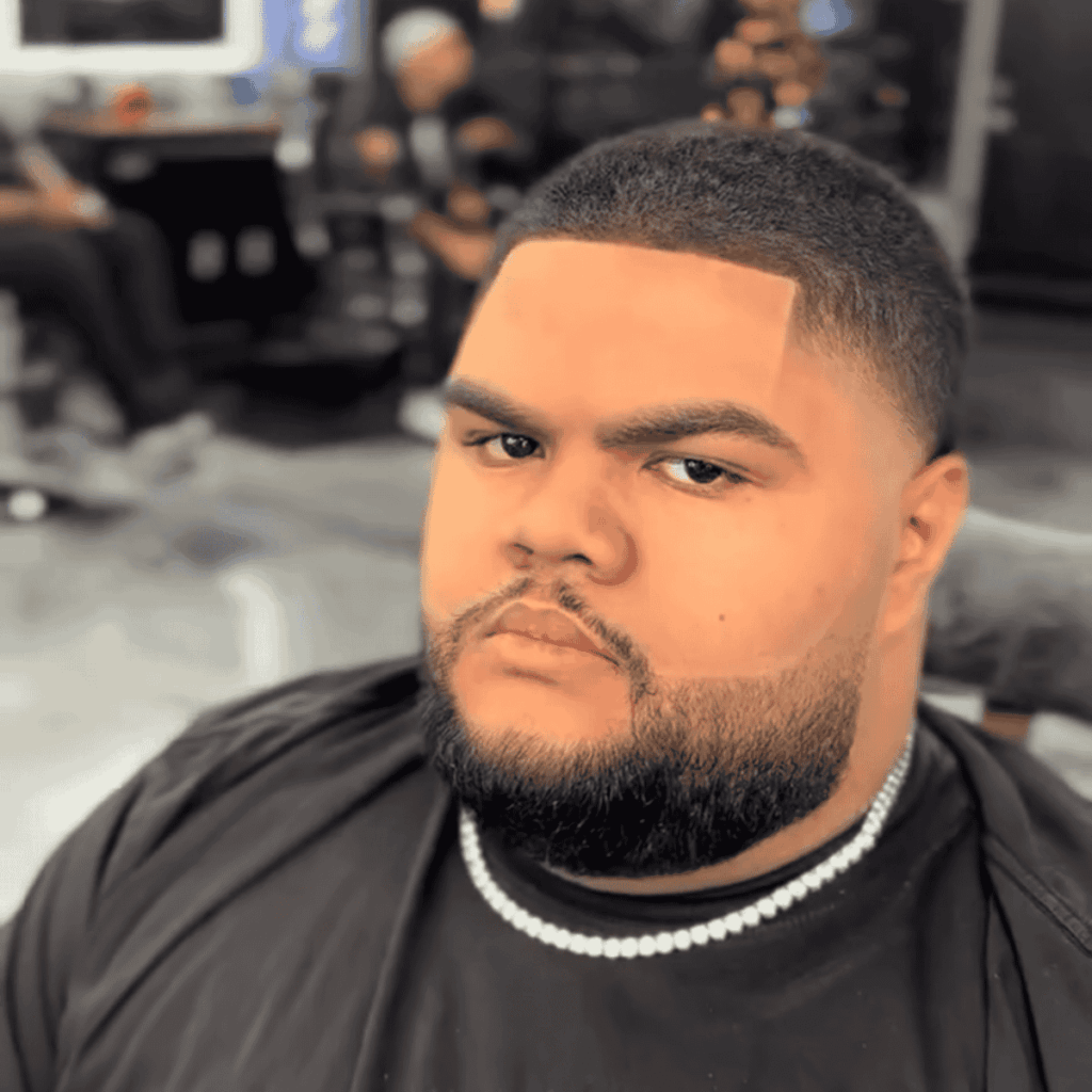 Detailed facial hair styling and trimming by a master barber.